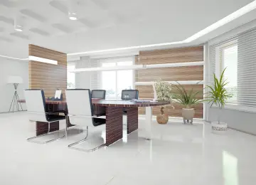 Modern office with wooden desk, white chairs, potted plants, and large windows with blinds. The space is enhanced with Hoya Ondol Heating Panels for optimum comfort. - Hoya Ondol Aust